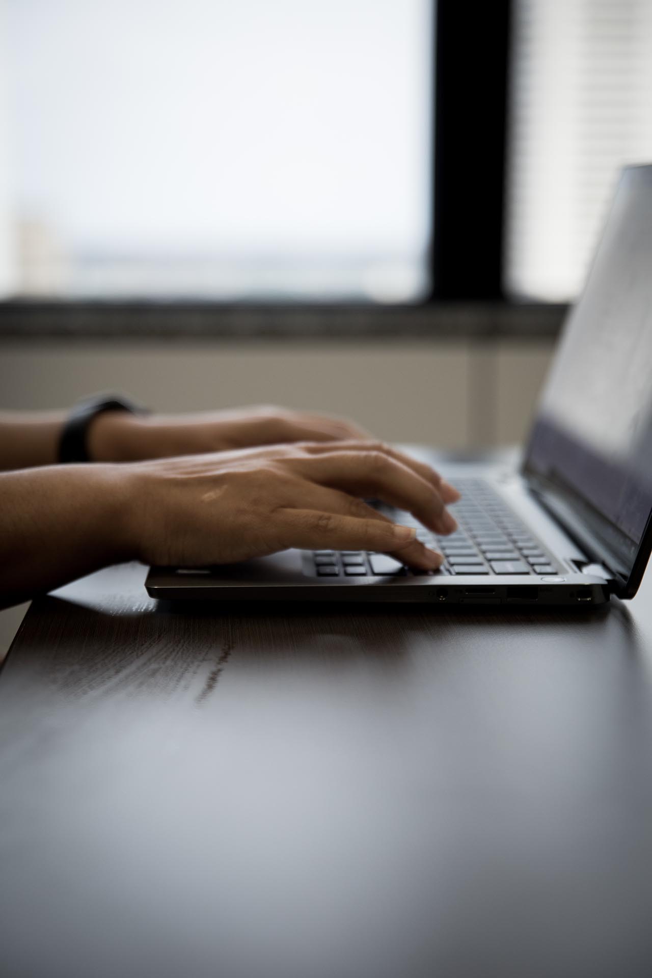 Person typing on laptop